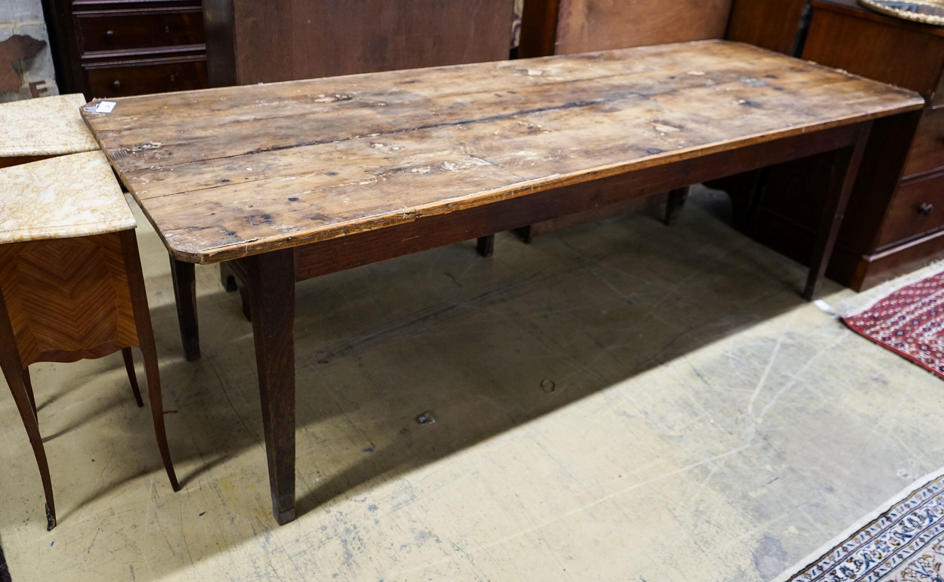 An early 19th century French provincial oak farmhouse table, length 243cm, depth 87cm, height 78cm